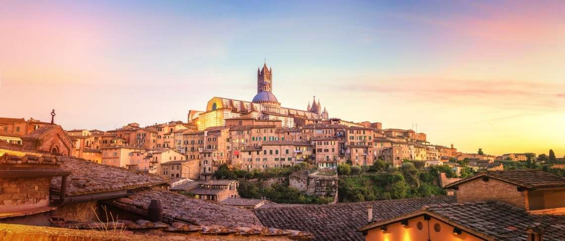 Visiter Sienne en 3 jours : vue sur la ville au coucher du soleil